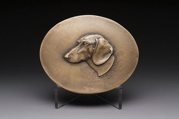 bronze canine sculpture medallion