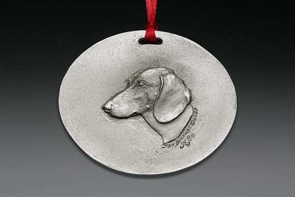 pewter canine sculpture medallion
