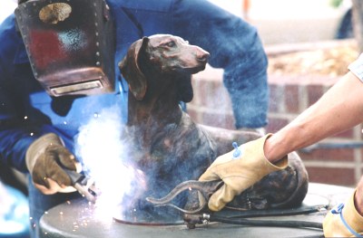 So Good To See You bronze Dachshund sculpture being welded