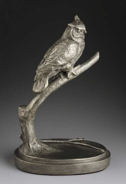 a bronze owl sculpture created by Joy Beckner