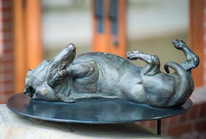 Sweet Roll life-size bronze Dachshund sculpture by Joy Beckner